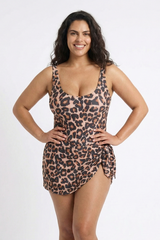 Woman wearing a leopard print swimsuit on a white background